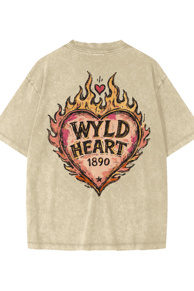 A beige mineral-wash t-shirt shown from the back, featuring a large graphic of a flaming heart with the text 'WYLD HEART 1890."