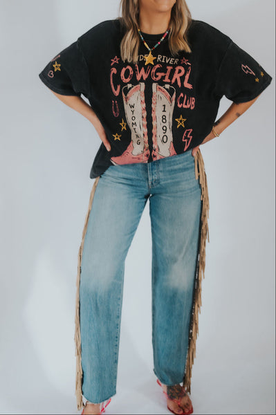 black graphic t-shirt with 'Powder River Cowgirl Club' text and a wyoming-themed print