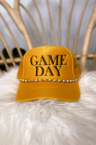 Brown and gold game day trucker hat