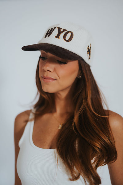 Corduroy WYO Hat -  bold WYO lettering on the front, the iconic bucking horse on the side, COWBOYS embroidery across the back, and vintage-inspired Wyoming patches,