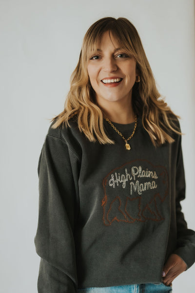 woman smiles and slowly turns in her cozy mama crewneck sweatshirt