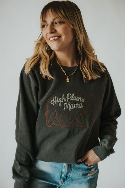 woman smiles in her high plains mama buffalo crewneck from RUBY WYLD
