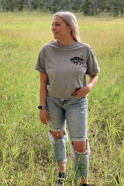 You‘re going to fall in love with this boyfriend tee in army green with buffalo stamping on the left chest + back. It has an oversized boyfriend fit with hand-distressed edges + rolled sleeves. Hand stamped by the insanely talented Burgundy Blooms right here in Casper, WY.