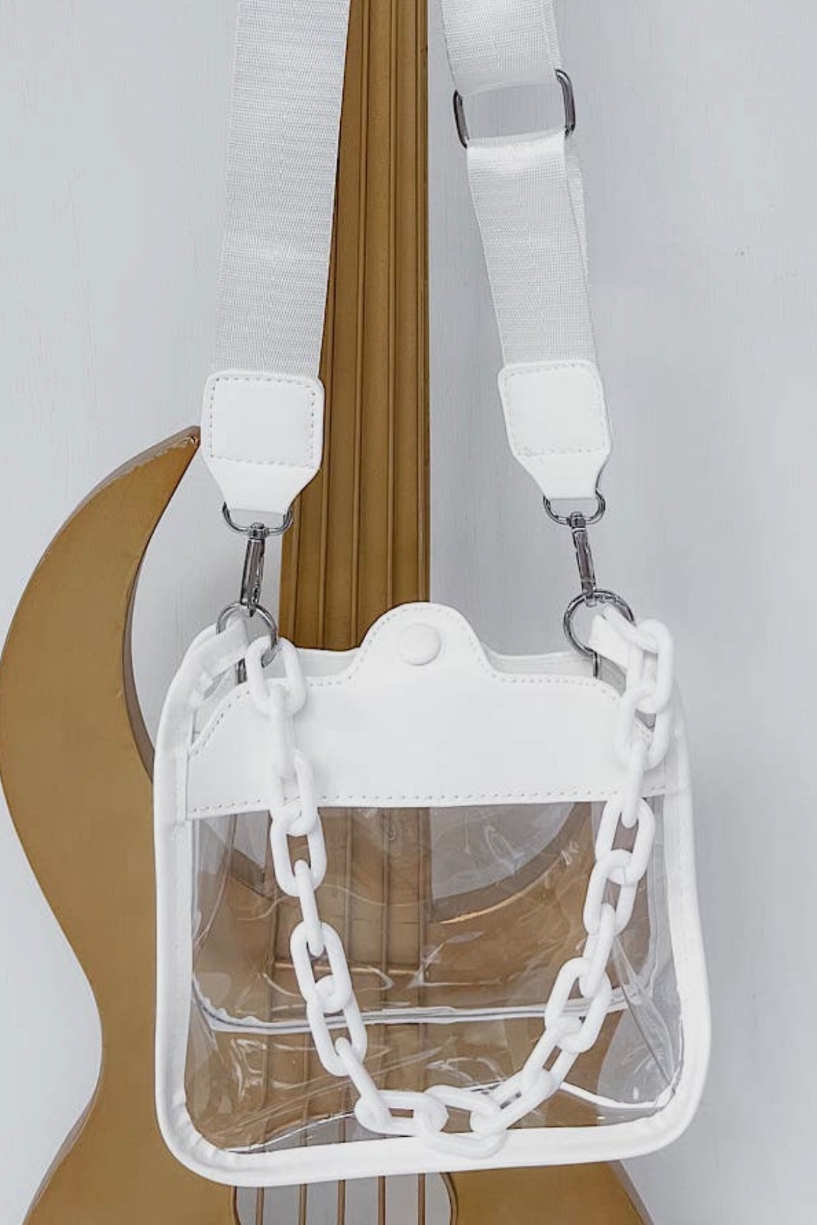 The Show Off Clear Crossbody features an adjustable strap for just the right fit + the cutest matching chain to also carry as a handbag! It‘s perfect for events that require clear bags such as sporting events or concerts, as well as for everyday use. These offer a stylish way to carry your essentials while keeping them visible + easily accessible!