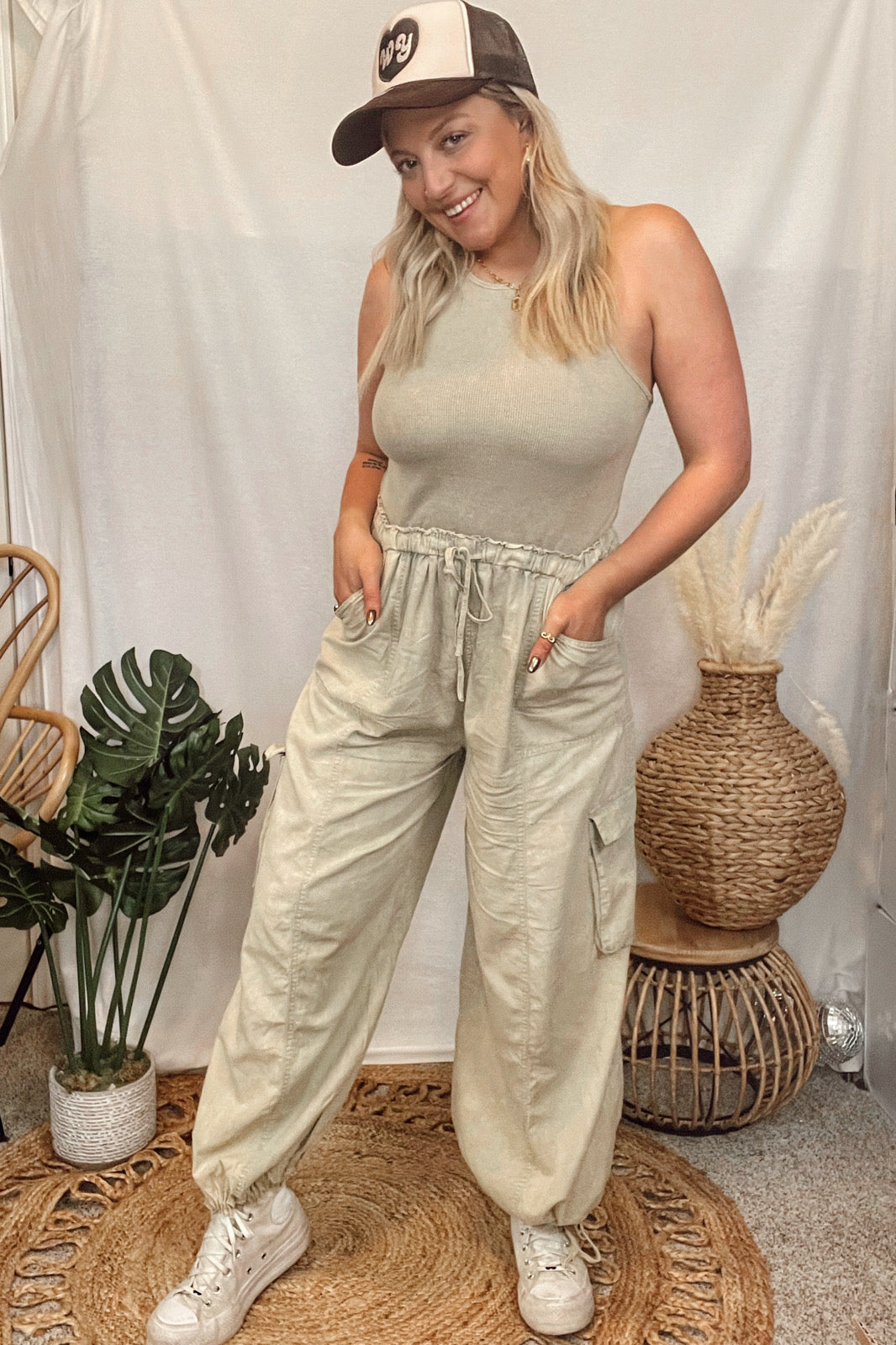 So chic. So comfy. So flattering. All the best details on this mineral wash, cargo pant jumpsuit.