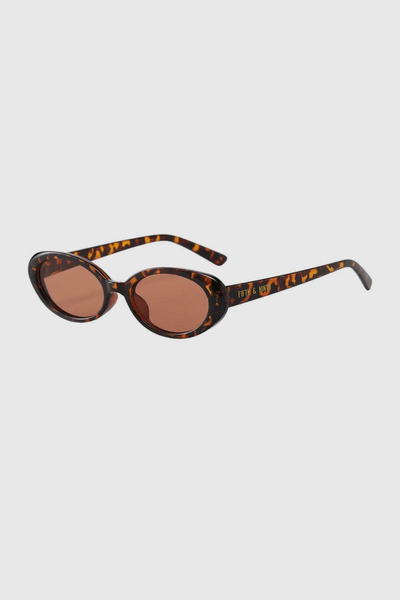 The perfect sunnies. These Dazed Babe Sunnies feature a coveted small oval frame that add the perfect flare to any look. Fun + super on-trend, Taya is available in black, torte + caramel.