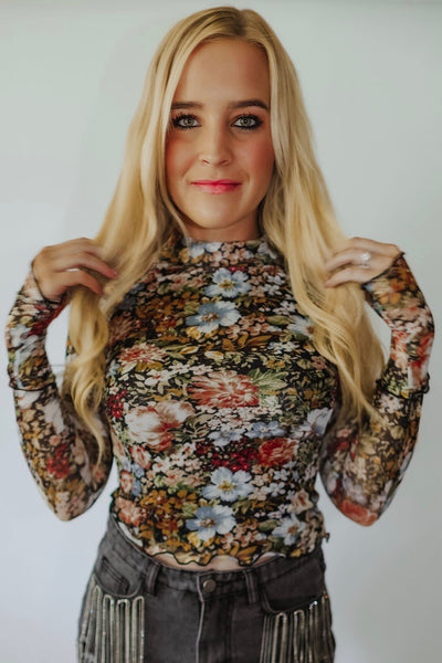 Dreamy floral print mesh top. Soft + comfy Semi sheer material. Super stretchy. High neckline — so cute peeking out from underneath your tops. Exposed seams. Long sleeves. THUMB HOLES!