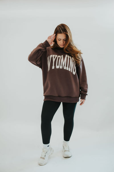 Reversible brown Wyo mock neck sweatshirt with WYOMING print on one side and WY on the reverse