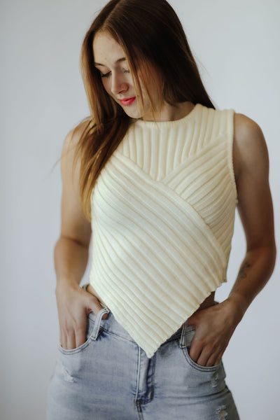 Ivory sweater tank ribbed to perfection with a scarf hem + crafted from a lightweight knit fabric, this stretchy top has a rounded neckline and a v bottom hem. Enjoy all-day comfort while looking stylish + chic.