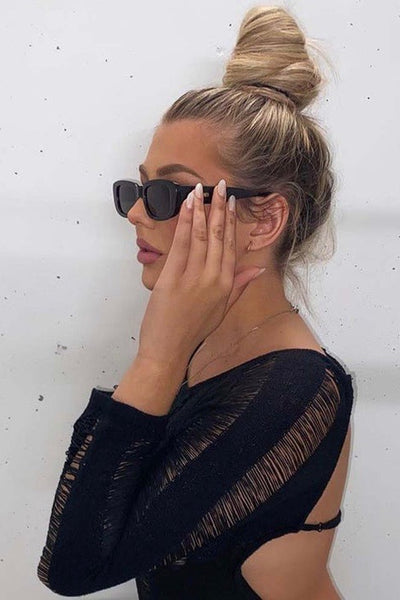 Our Alter Ego Sunnies feature a sleek '90s inspired rounded rectangular frame. These look rad on everyone + will be your go-tos. These sunnies feature a high-quality frame with 100% UVA + UVB protection because we know looking the part is only half the battle.