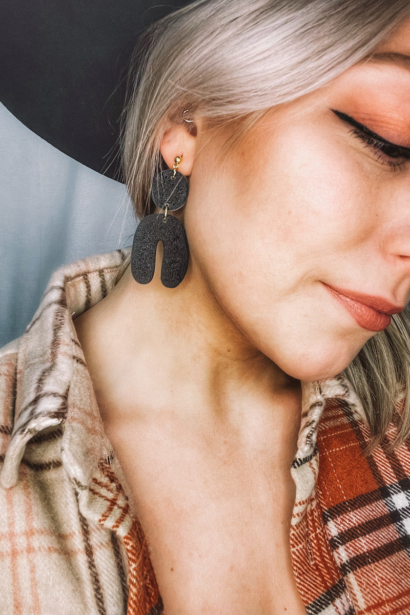 textured clay arch earrings.