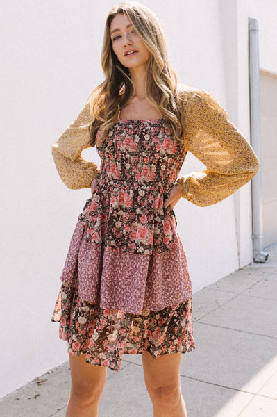 color-blocked floral tiers. long bubble sheer sleeves. square neck. perfect mini length dress.