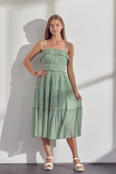 Prettiest midi dress ever Gorge dusty sage color Covered elastic at top hem + waist Slim adjustable shoulder straps Smocked bodice Tiered silhouette with ruffles Stripe lined fabric