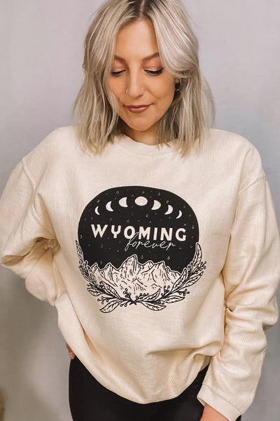 Wyoming forever graphic featuring boho Tetons backdrop. Corded Crewneck.