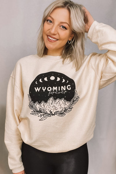 Wyoming forever graphic featuring boho Tetons backdrop. Corded Crewneck.