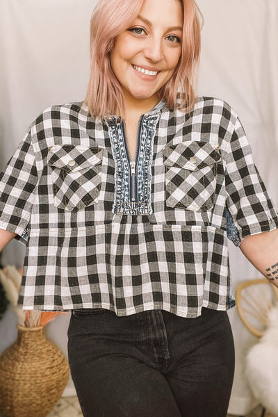 flattering on every body type gingham blouse. denim contrast detailing. front zipper. chest pockets.